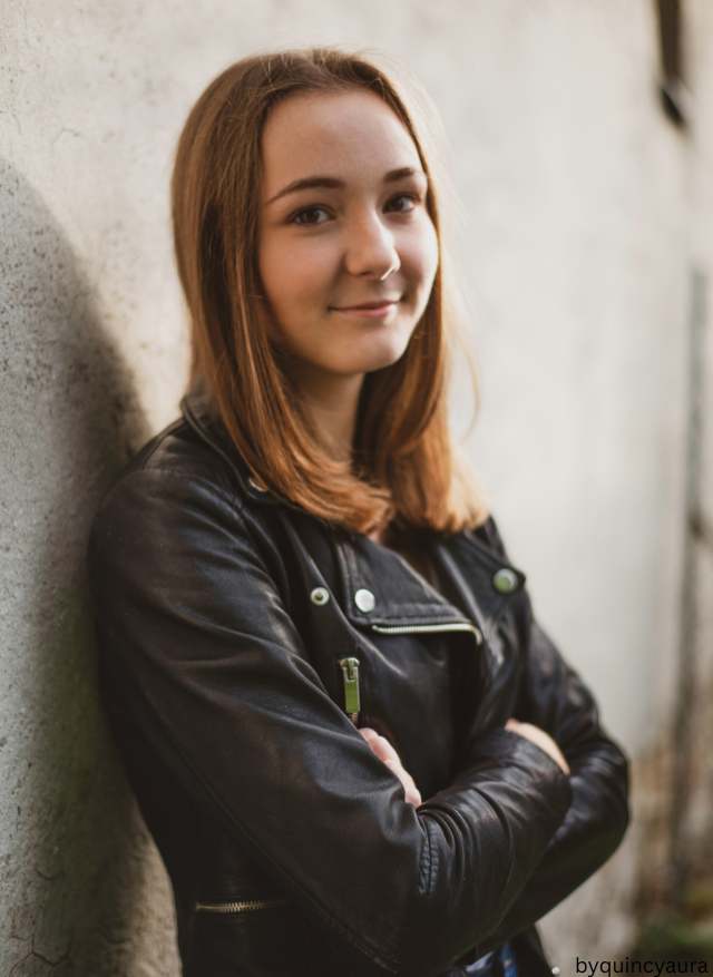 Woman wearing black faux leather jacket