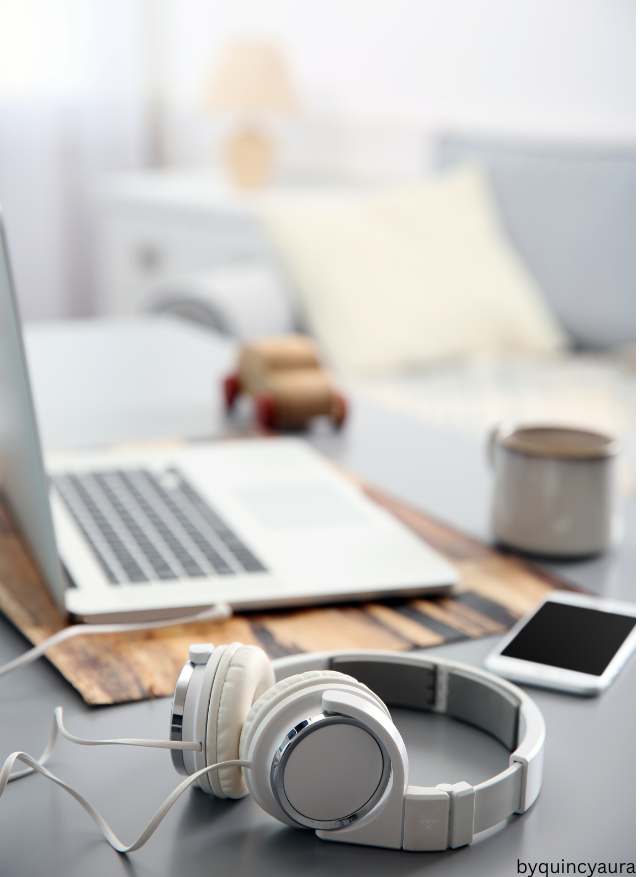 A pair of men’s headphones placed on a clean surface.