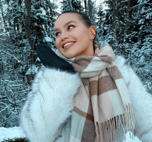 A woman outdoors in a fully styled winter outfit