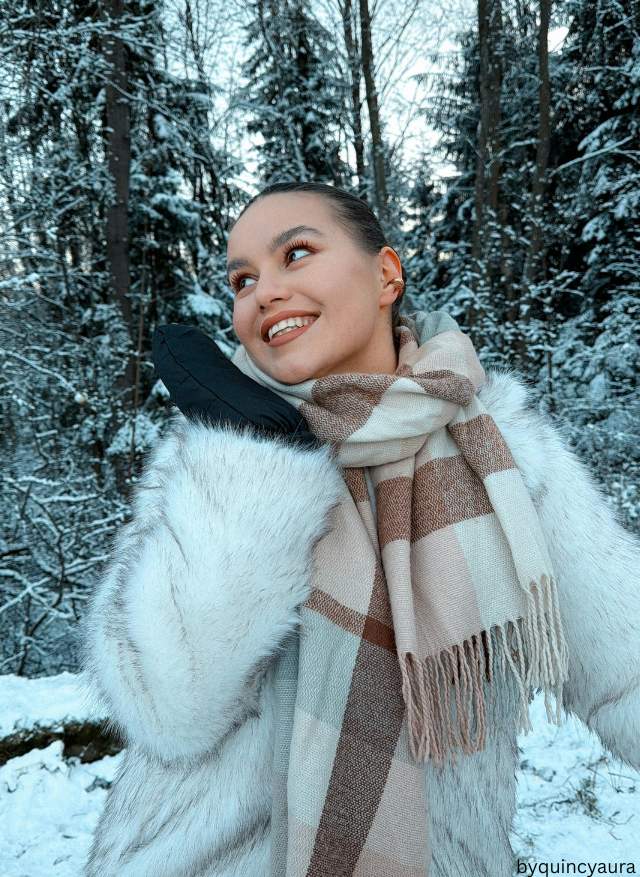 A woman outdoors in a fully styled winter outfit