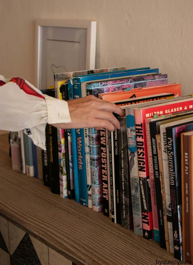 A neatly stacked set of men’s books.