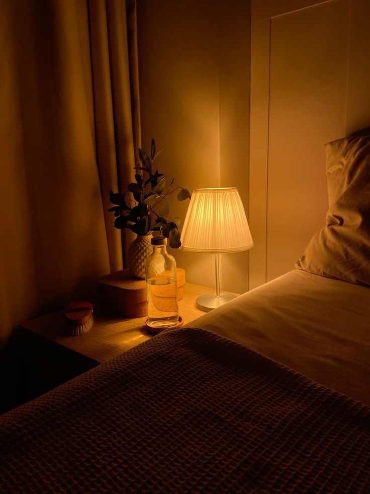 A cozy bedroom at night with dim lighting