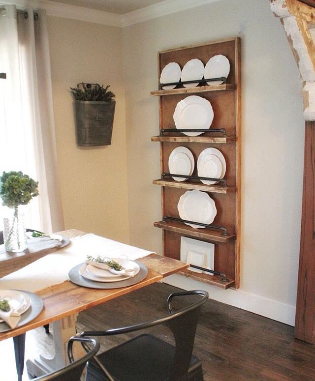 Floating wooden shelves near  a small dining table