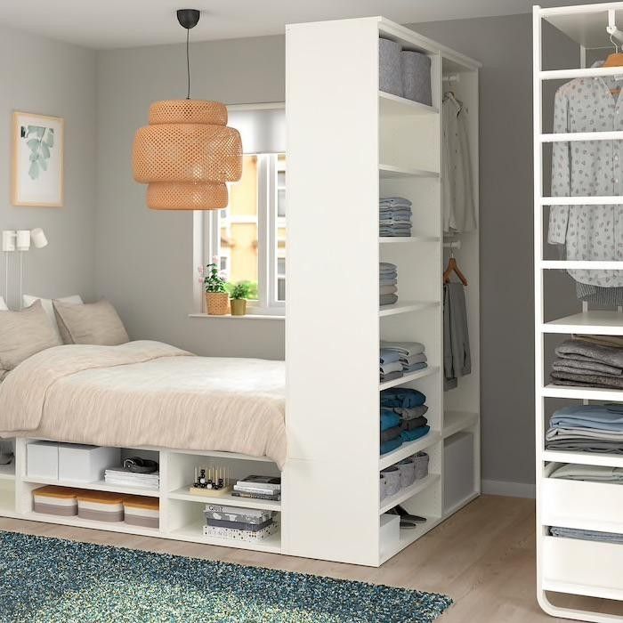 A studio apartment with tall shelves.