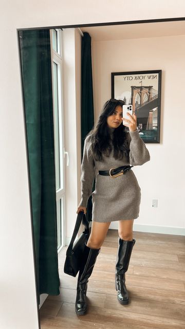 Neutral sweater dress styled with ankle boots.