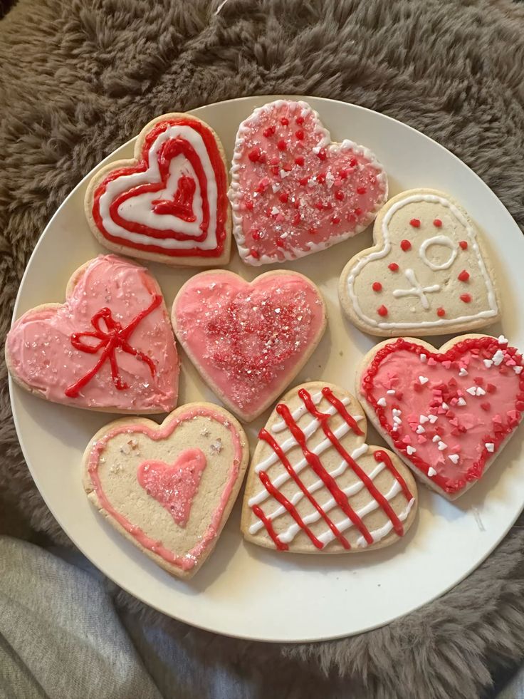 Heart shaped sugar cookies on a white plate