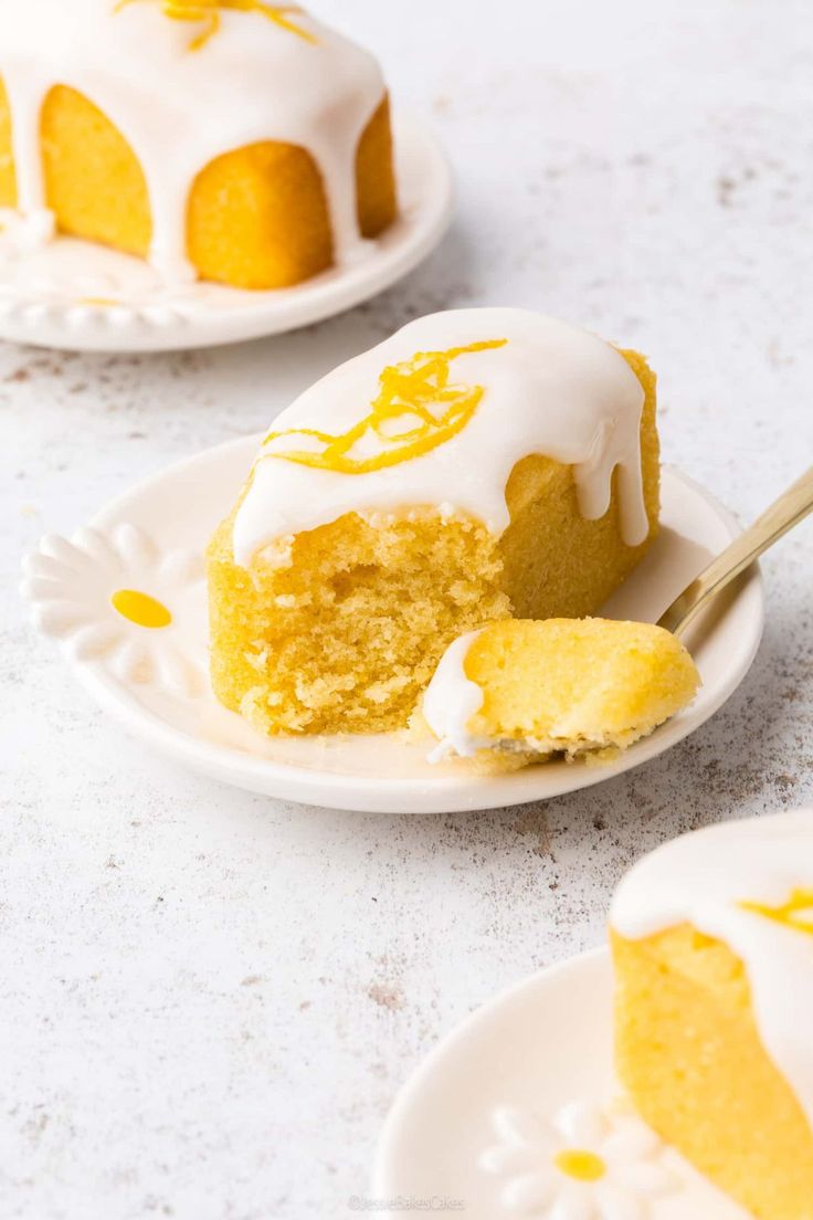 Lemon drizzle mini loaf served in a plate with spoon beside it