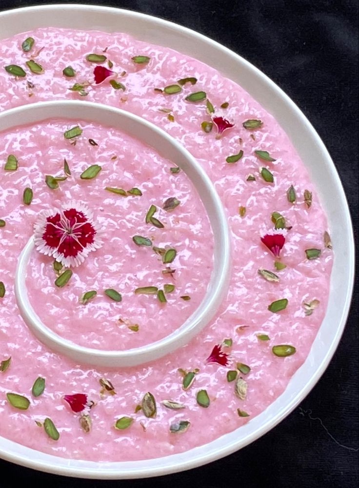 Rose flavored rice pudding served in a white dish
