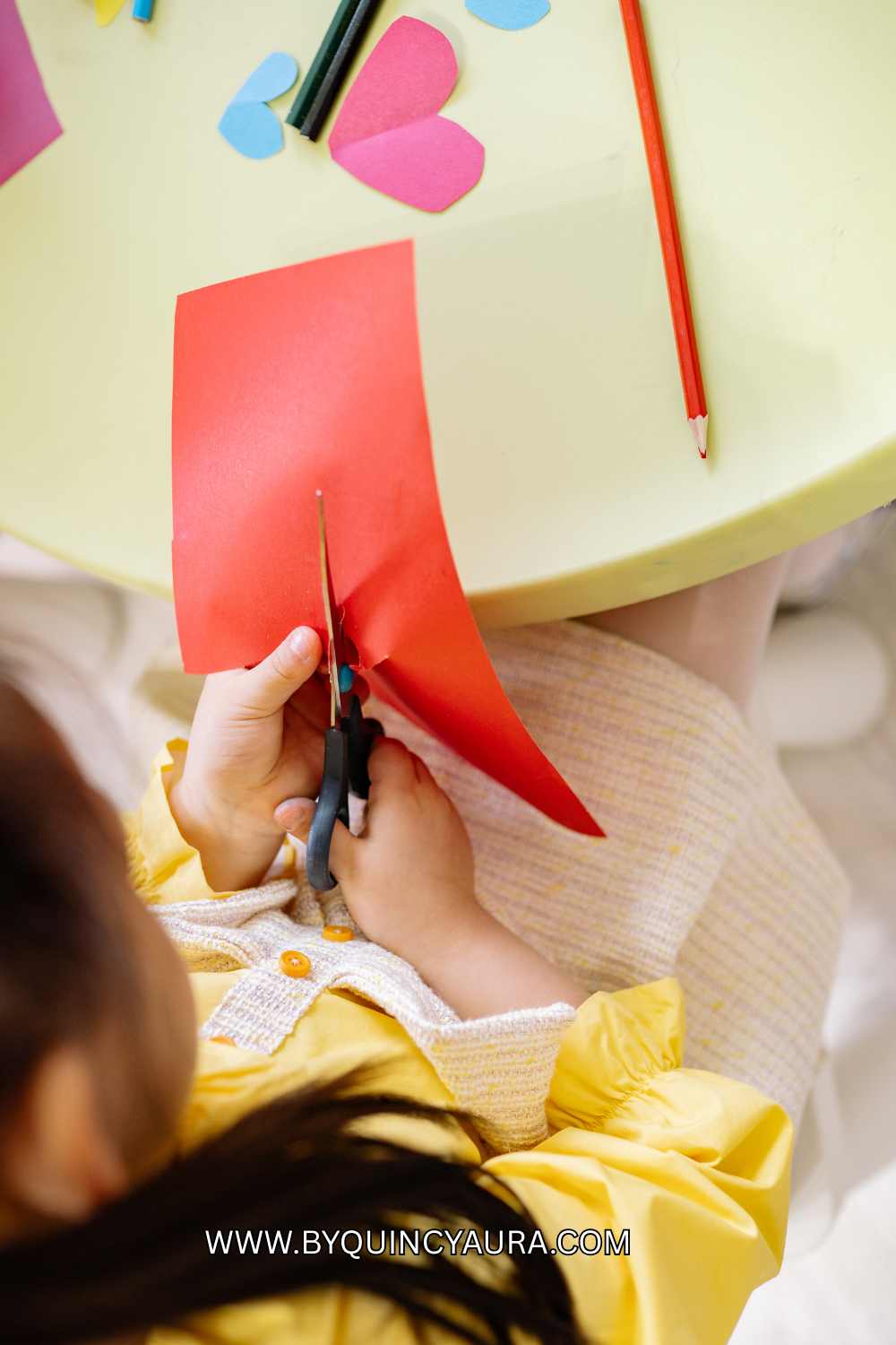 A girl doing paper craft