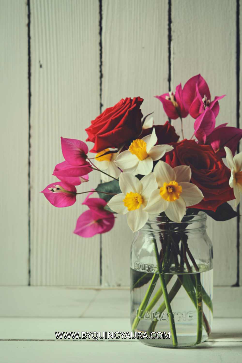 flower jar with flower in it.