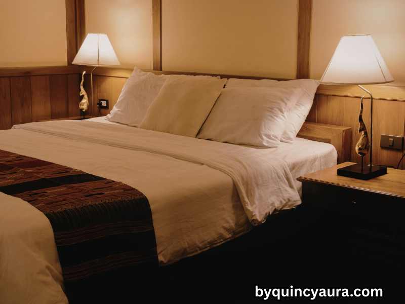 Cozy bedroom with layered lighting, bedside lamps, warm bulbs, and budget-friendly decor for a luxurious feel