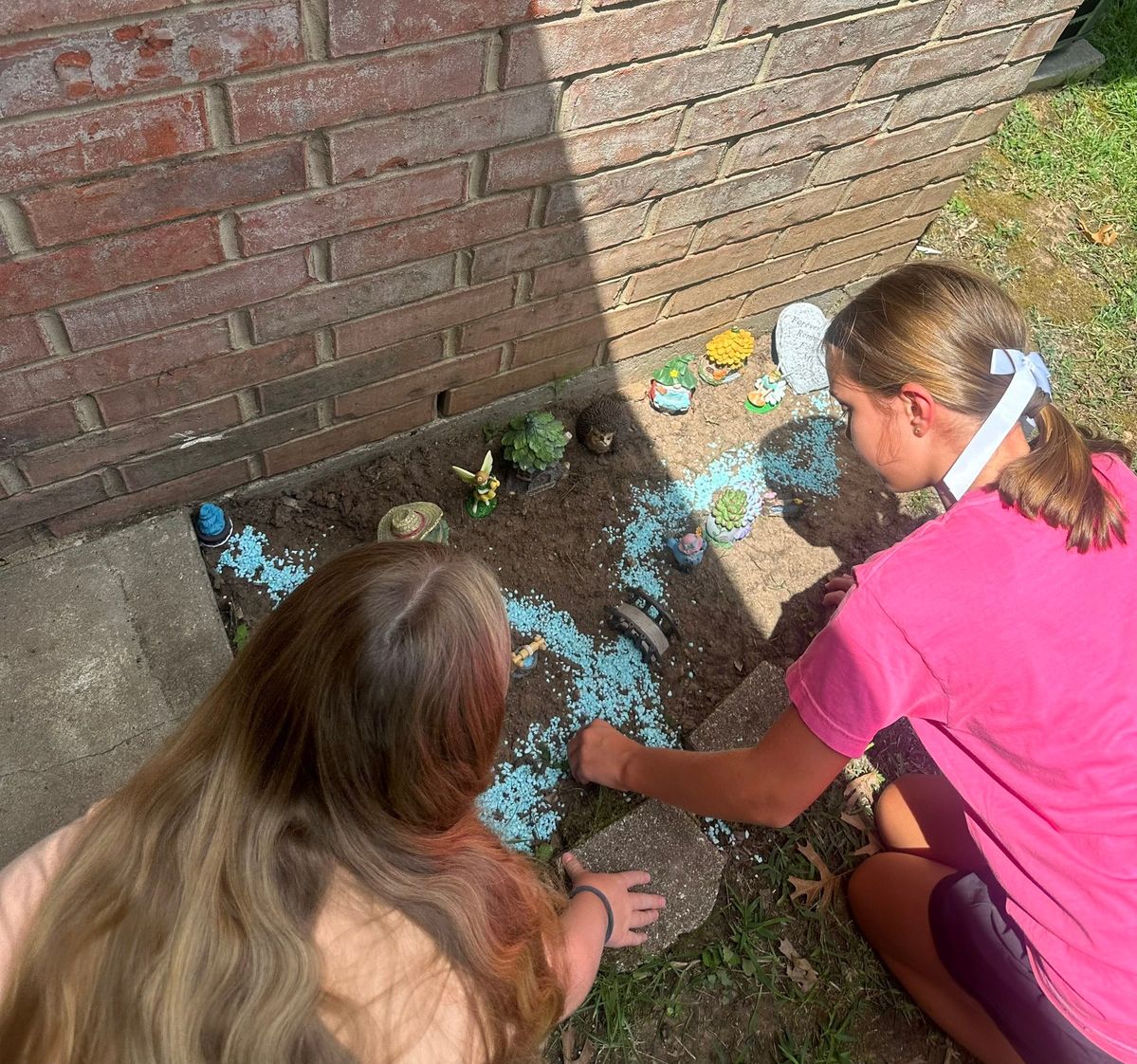 family planting a fairy garden
