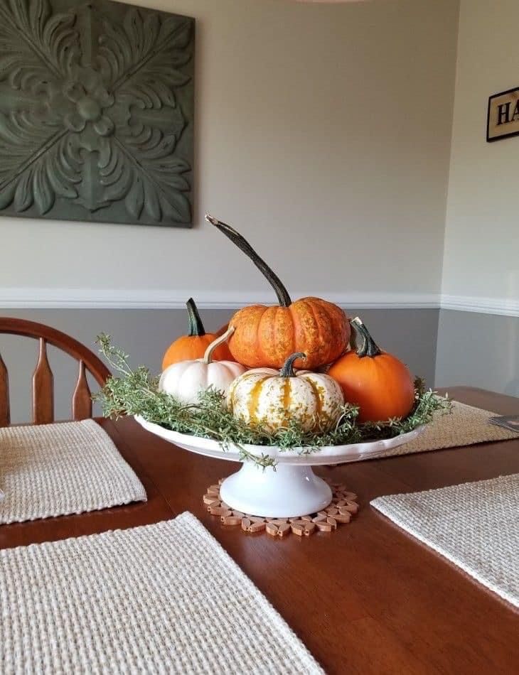 A cake stand can display pumpkins.