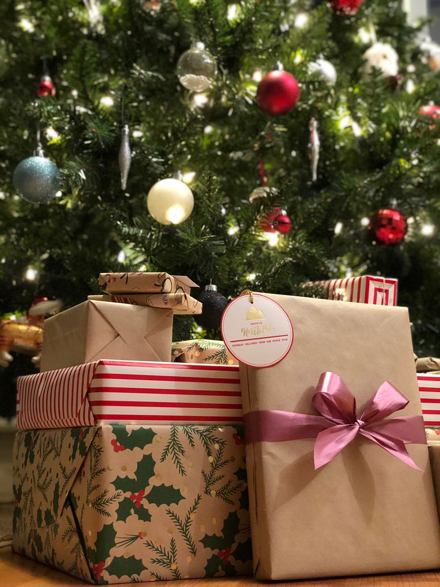 a few wrapped gifts underneath the tree